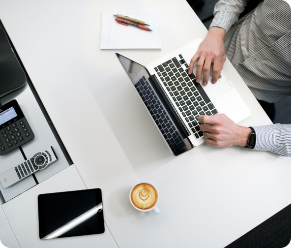 Person sits at their laptop preparing an Adroll campaign.