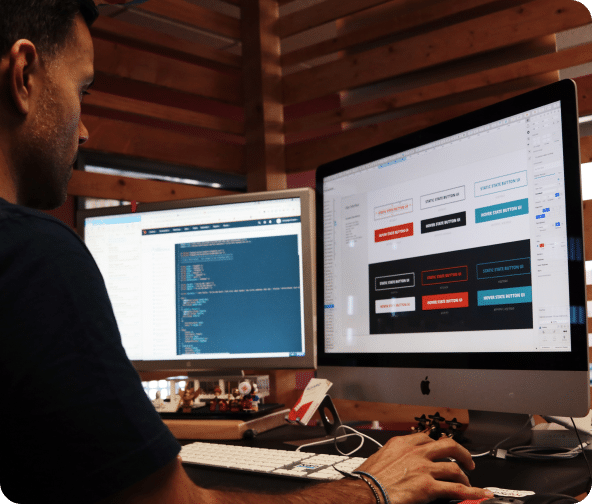 Developer at work building buttons for a website