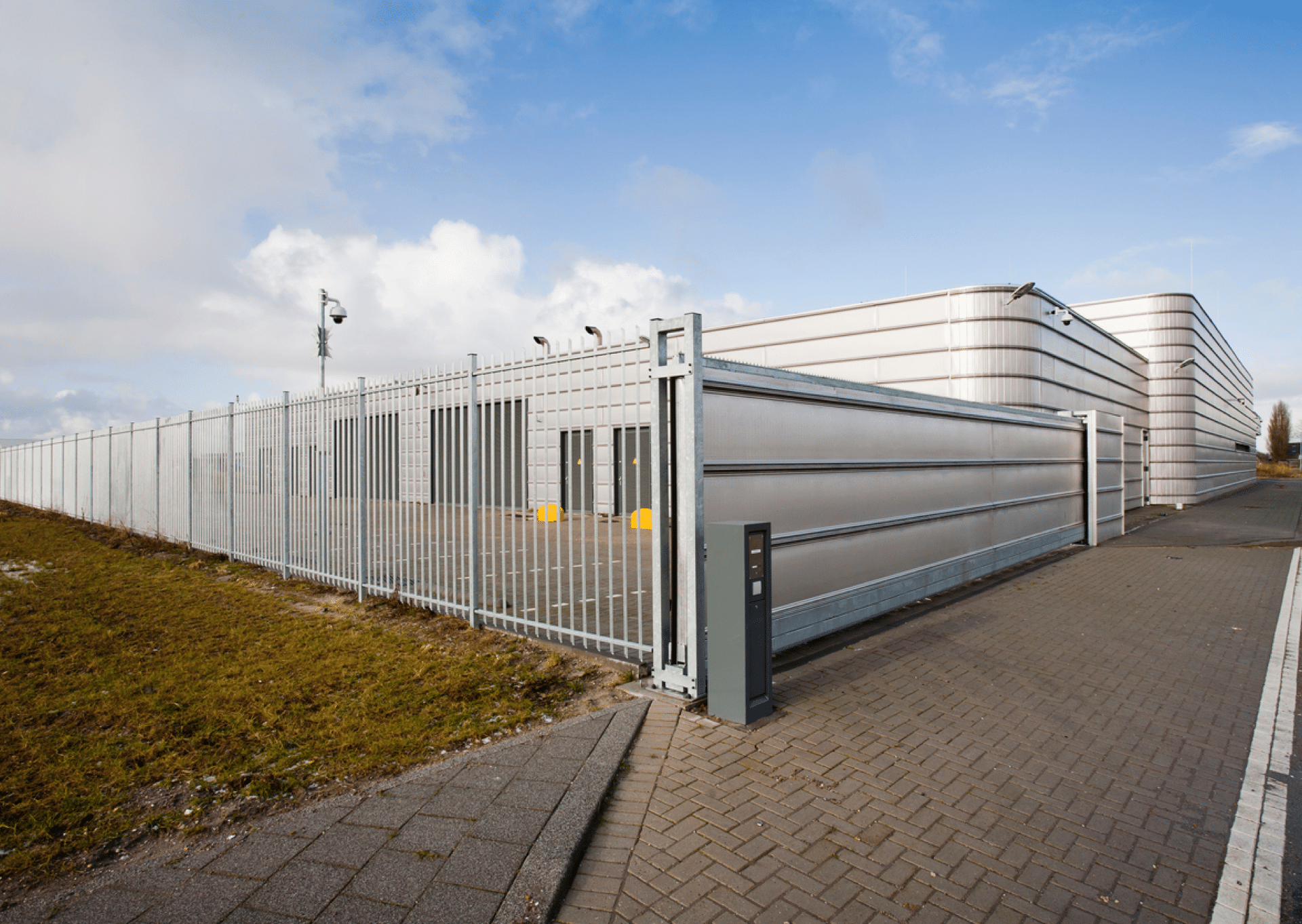Perimeter gate with CCTV cameras installed by Guardian Access Solutions for business safety.