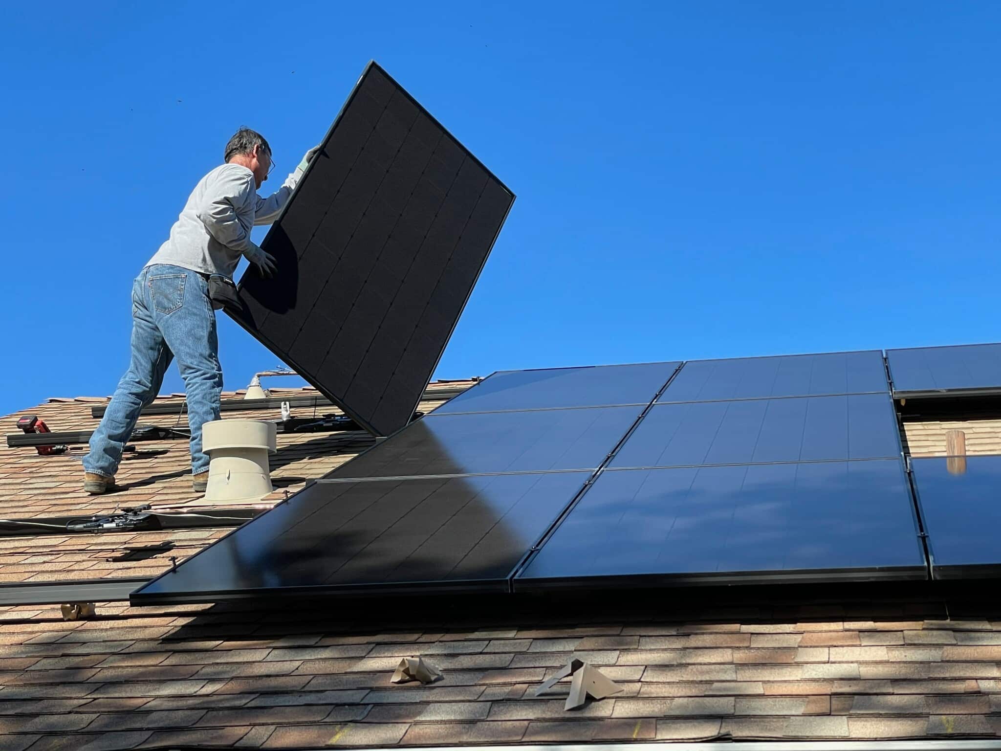 JTE Solar installs solar panels on a roof with.