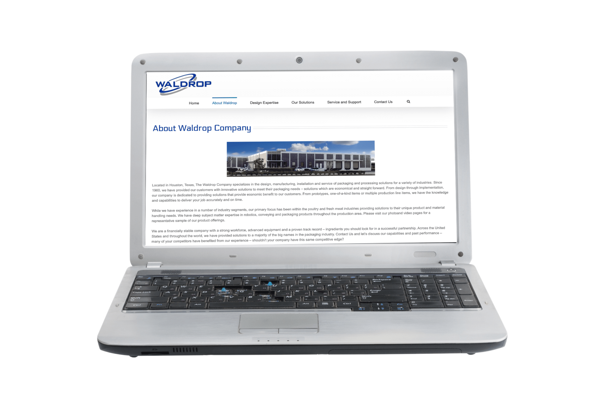 Open laptop with the About Waldrop Company webpage visible.