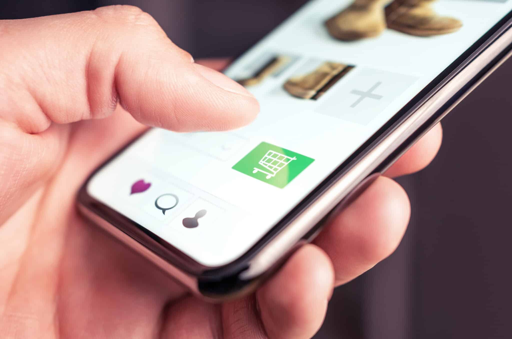 Plan Left eCommerce app shown in users hand with visible green shopping cart.