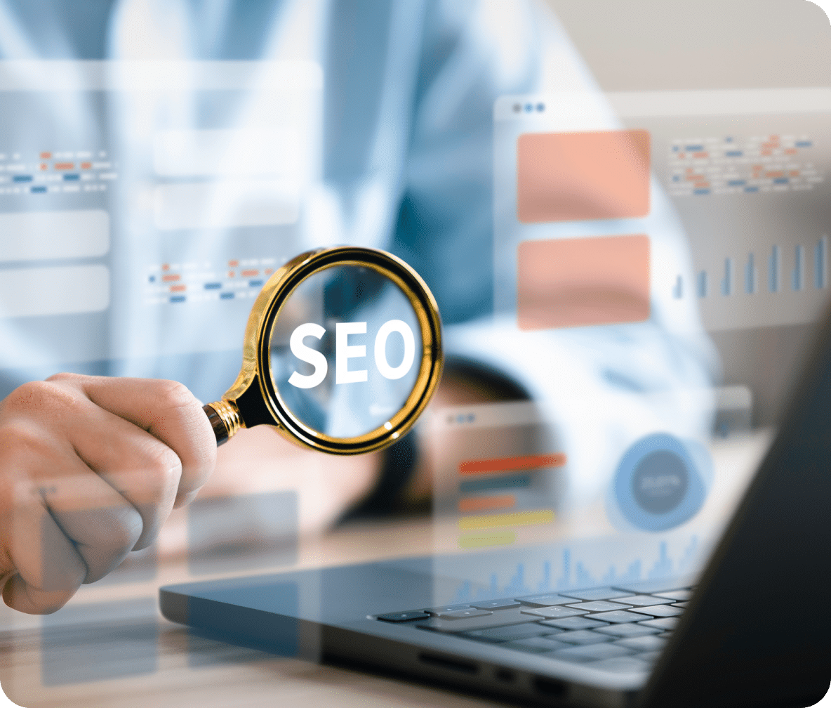 Magnifying glass with SEO in the glass, with data charts floating around a laptop.