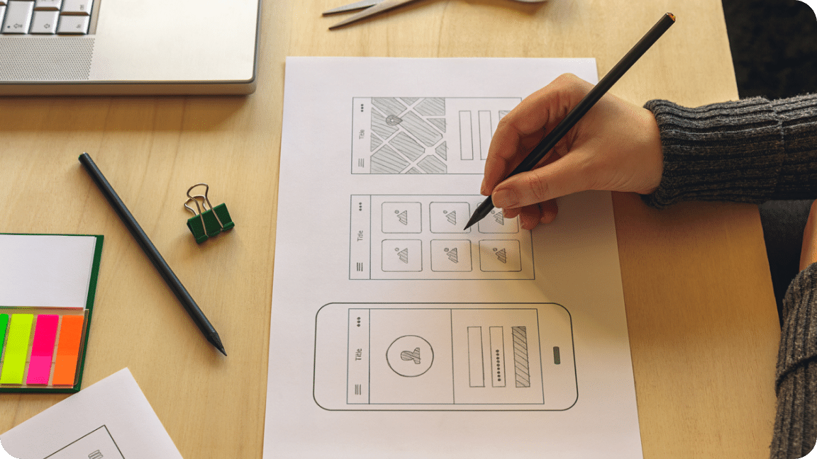 Drawing mockup of mobile app design with edits being made.