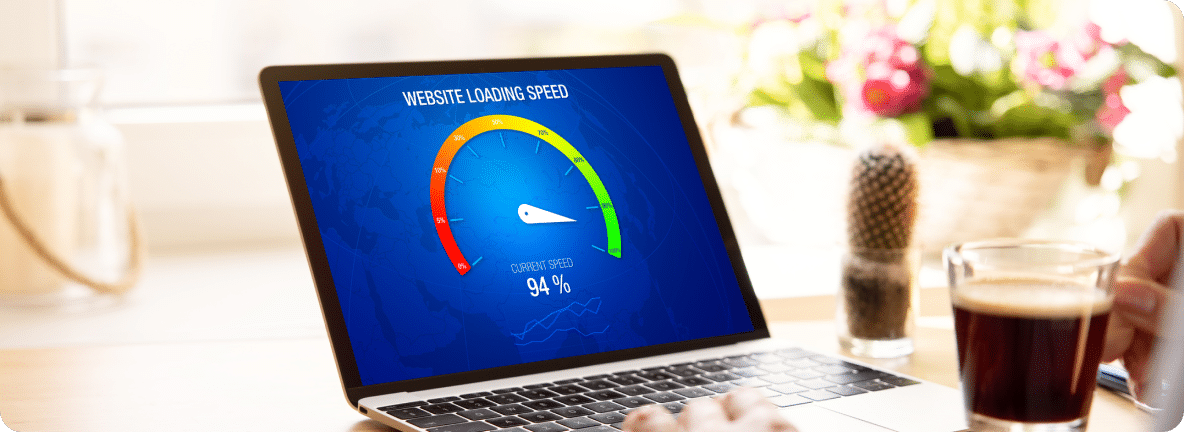 A laptop screen shows a meter gauge reporting the web page load speed of a website at 94%.